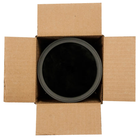 Black pot inside an open cardboard box on a white background