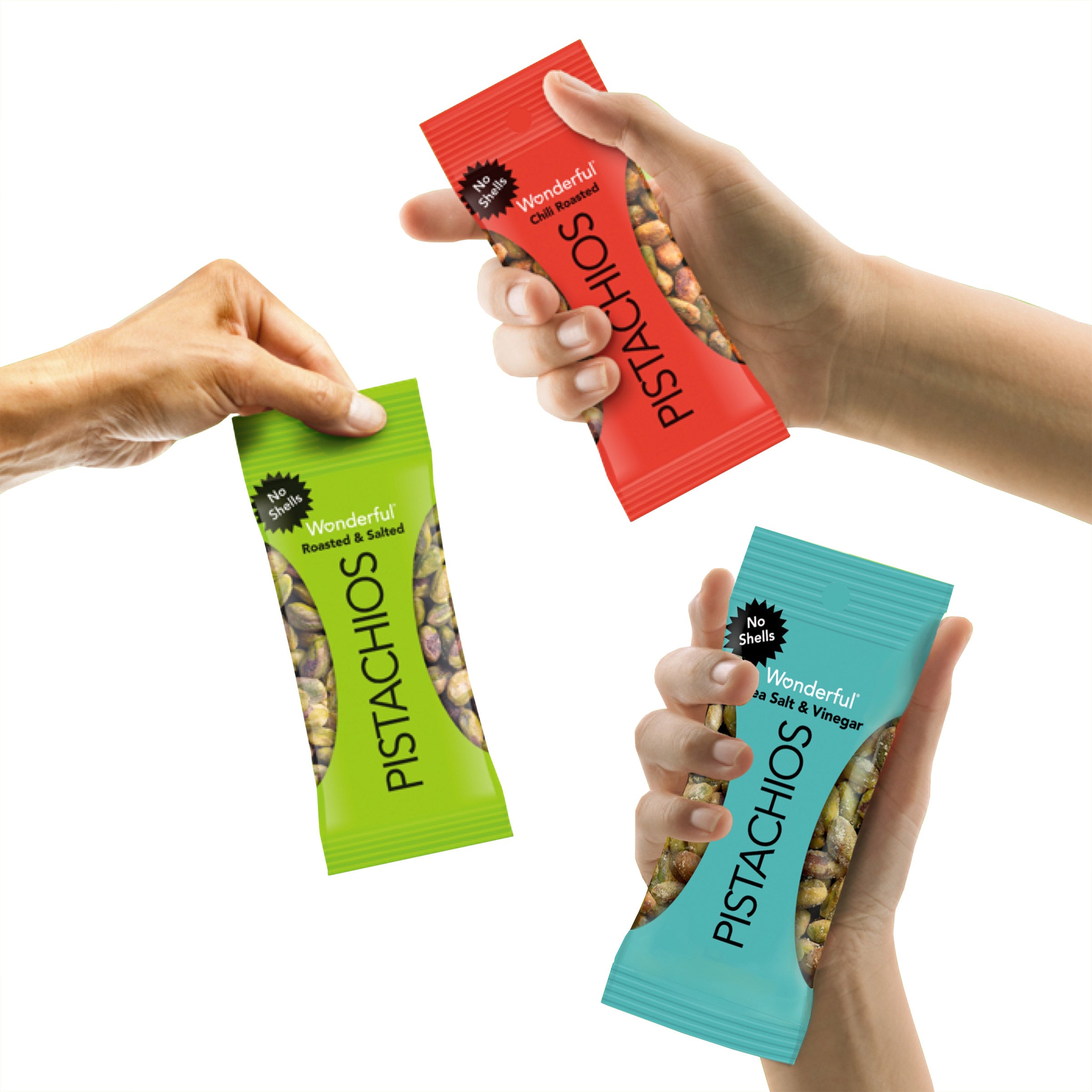 Three hands holding packages of Wonderful Pistachios in different flavors on a white background