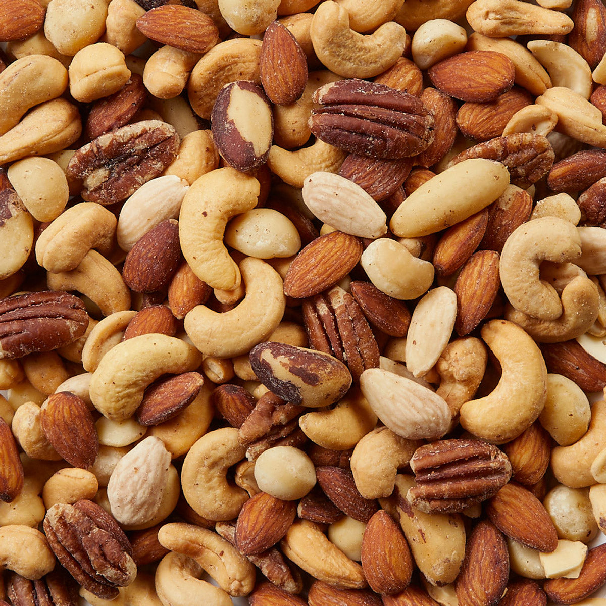 Assorted nuts including almonds, cashews, and pecans.
