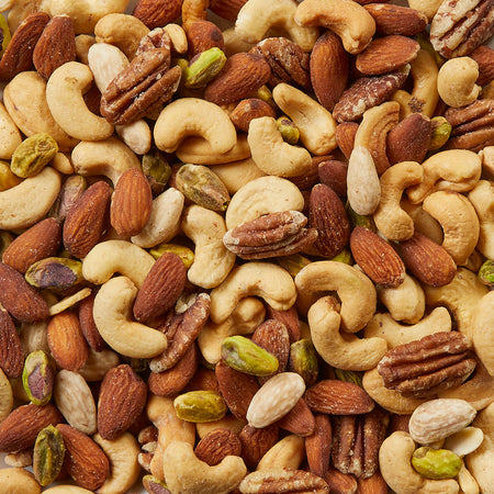 Assorted nuts including almonds, cashews, and pistachios.