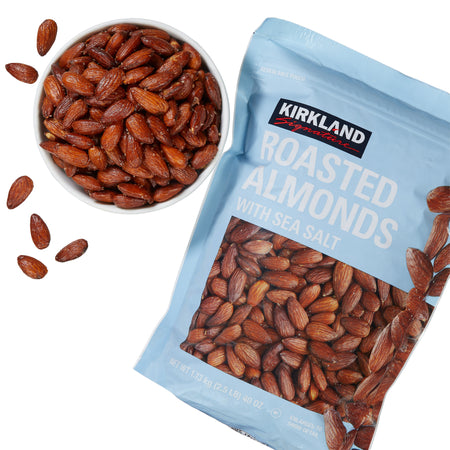 Kirkland Roasted Almonds with Sea Salt package and bowl of almonds on a white background