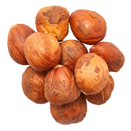 Cluster of hazelnuts on a white background