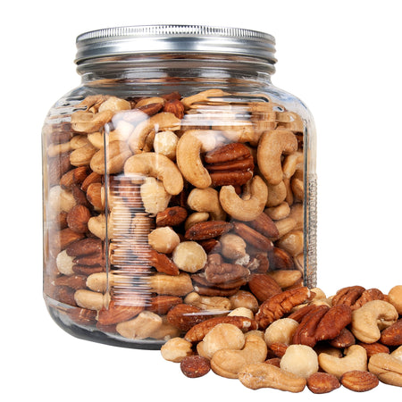 Glass jar filled with a mix of nuts on a white background
