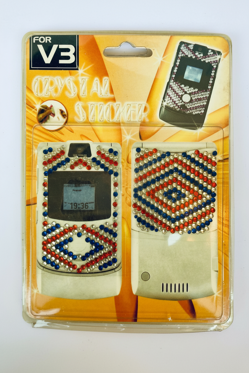 Packaged crystal-studded V3 phone case with decorative patterns on a white background