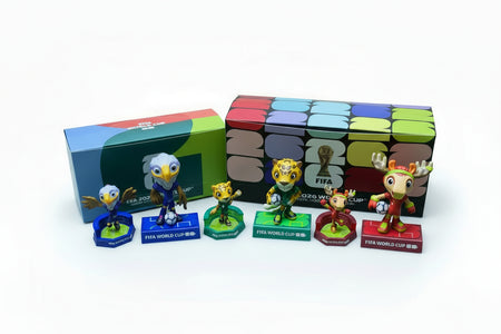 FIFA World Cup figurines with a colorful box on a green background