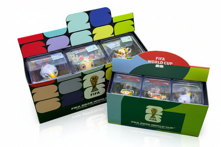 FIFA World Cup trading card boxes with cards inside on a green background