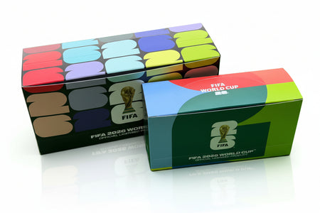 Two FIFA World Cup 2022 boxes on a green surface