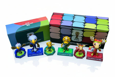 FIFA World Cup figurines with a colorful box on a green background