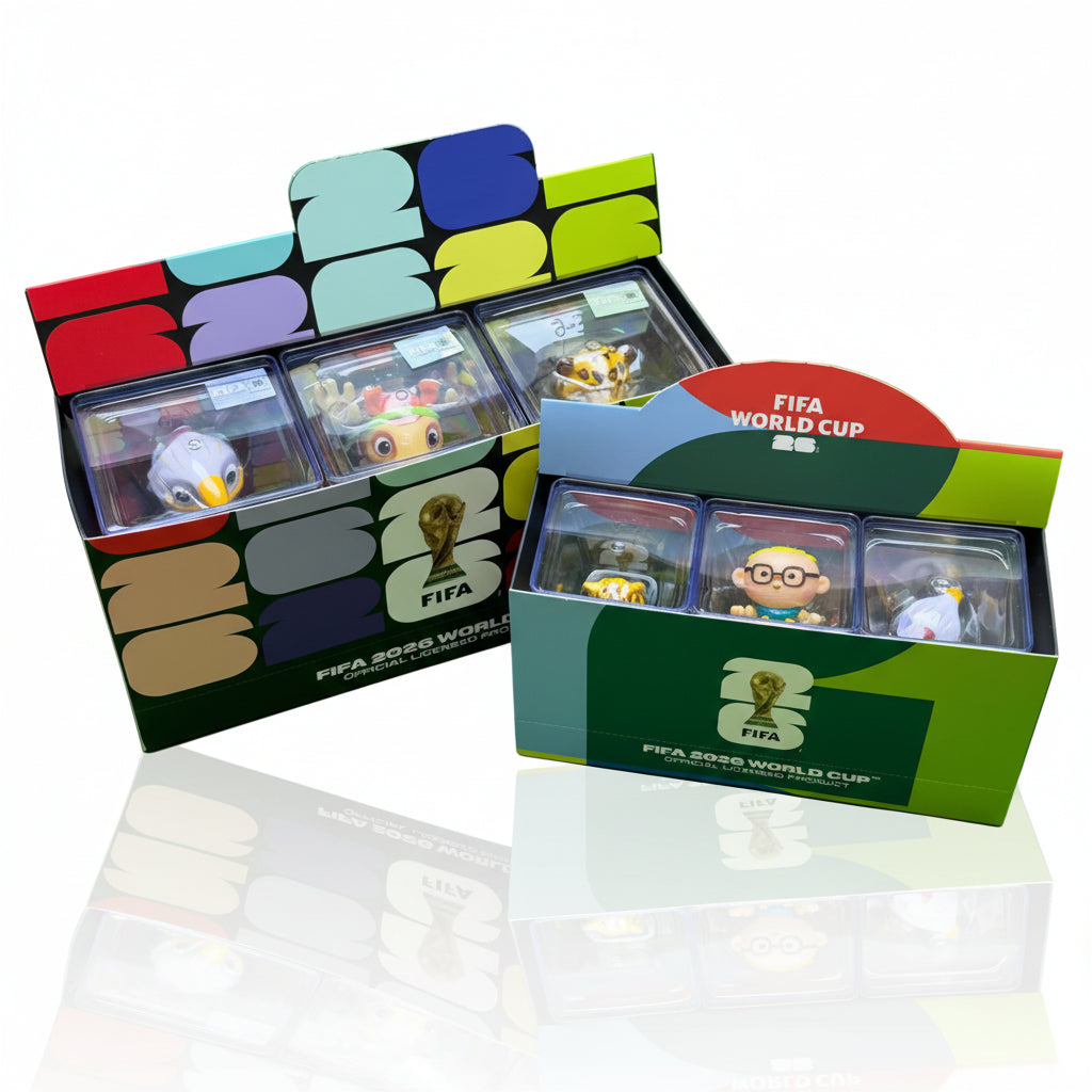 FIFA World Cup trading card boxes with cards inside on a green background