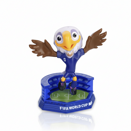 Figurine of an eagle in a blue stadium with 'FIFA World Cup' branding on a transparent background