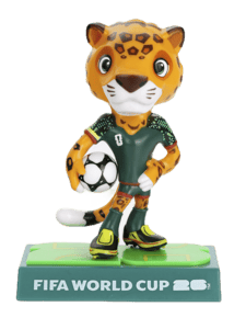 FIFA World Cup figurine with a leopard-like character holding a soccer ball on a green base.