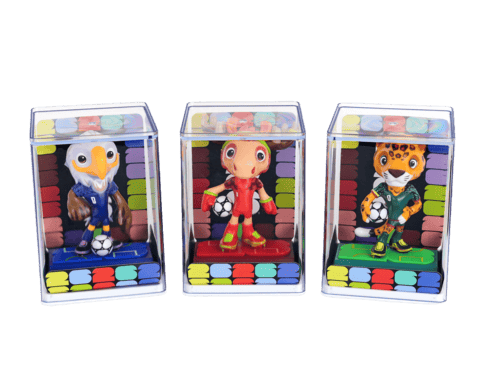 Three colorful toy figures in transparent display cases on a white background