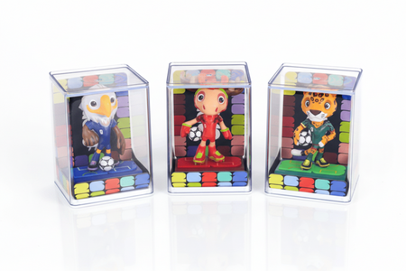 Three colorful toy figures in transparent display cases on a white background