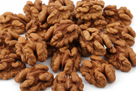 Close-up of premium walnut halves showing rich brown color and perfect whole halves