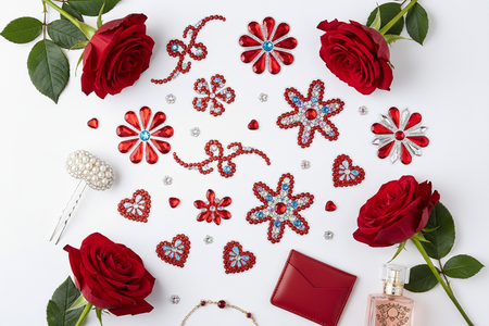 Red multi-color rhinestone phone stickers flat lay with red roses and elegant accessories