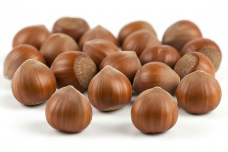 Close-up of raw whole shelled hazelnuts showing natural brown skin