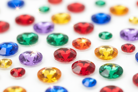 Close-up of red multi-color rhinestone bling stickers showing individual sparkling gems