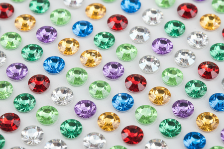 Close-up of light green multi-color rhinestone bling stickers showing individual sparkling gems