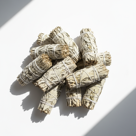 White sage smudge sticks arranged in group showing natural variations