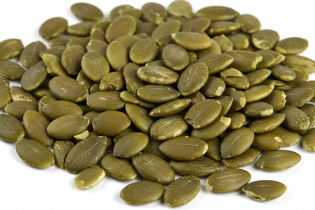 Close-up of organic green pumpkin seeds pepitas showing natural color and texture