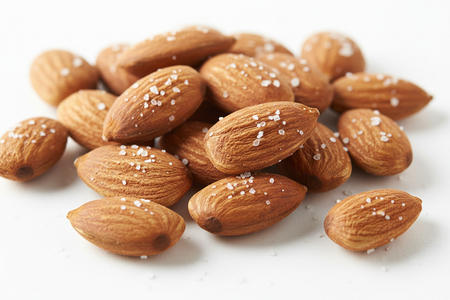 Close-up of lightly salted almonds showing golden roasted color and light salt coating