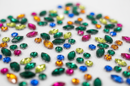 Close-up of green multi-color rhinestone bling stickers showing individual sparkling gems